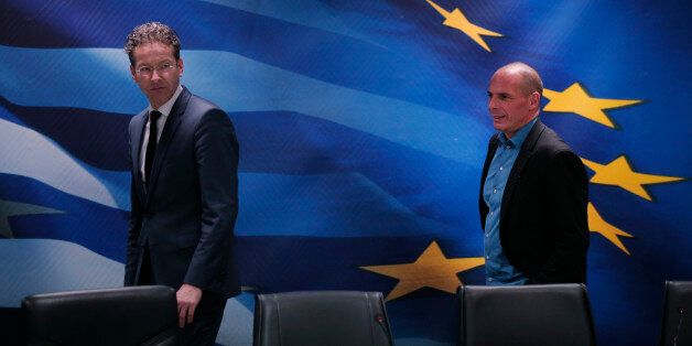 Dutch Finance Minister and Eurogroup President Jeroen Dijsselbloem, left, followed by Greece's Finance Minister Yanis Varoufakis, right, arrive for a joint news conference following their meeting at the Finance Ministry in Athens, Friday, Jan. 30, 2015. Dijsselbloem who chairs eurozone finance meetings says there is no decision so far on what to do after Greeceâs current bailout program runs out at the end of next month. (AP Photo/Lefteris Pitarakis)