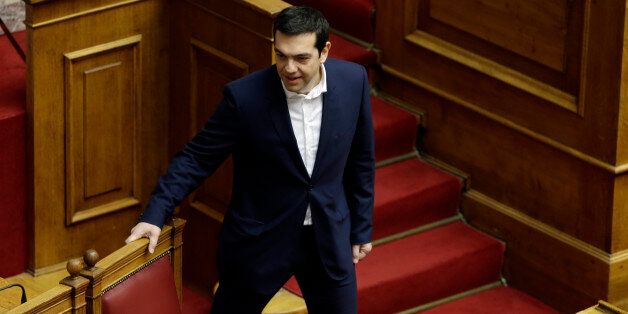 Greece's Prime Minister Alexis Tsipras arrives for the swearing ceremony at the first convention of Parliament since the Jan. 25 elections in Athens on Thursday, Feb. 5, 2015. Non Greek Orthodox lawmakers were sworn in with a secular, or Muslim version of the oath. Jittery investors dumped Greek shares Thursday after the European Central Bank tightened the screws on the country's banking system, piling pressure on the new anti-austerity government to seek a compromise with bailout creditors. (AP Photo/Thanassis Stavrakis)
