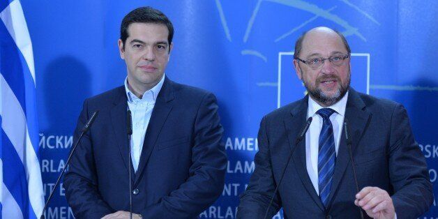 BRUSSELS, BELGIUM - FEBRUARY 04: European Parliament President Martin Schulz (R) gives speech during a joint press conference with Greek Prime Minister Alexis Tsipras (L) after their meeting at the European Parliament in Brussels, Belgium on February 4, 2015. (Photo by Dursun Aydemir/Anadolu Agency/Getty Images)