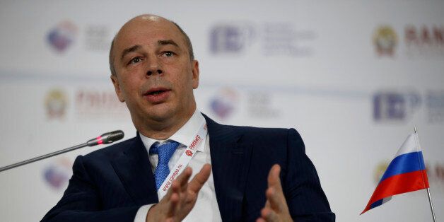 Russia's Finance Minister Anton Siluanov addresses the Gaidar Forum in Moscow, Russia, Wednesday, Jan. 14, 2015. Siluanov said an earlier plan to boost government spending by nearly 12 percent this year is unrealistic, and some of the planned expenditures should be cut. Siluanov has promised to maintain a tight lid on spending as the country faces its worst economic downturn in 15 years. (AP Photo/Pavel Golovkin)