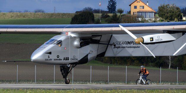 The solar-powered Solar Impulse 2 aircraft takes off on November 13, 2014 in Payerne during a test flight with Swiss Bertrand Picard piloting. Piccard conducted one of the last test flight in Switzerland. The attempt to fly around the world in stages using only solar energy will be made from March 2015 starting in Abu Dhabi. AFP PHOTO / FABRICE COFFRINI (Photo credit should read FABRICE COFFRINI/AFP/Getty Images)