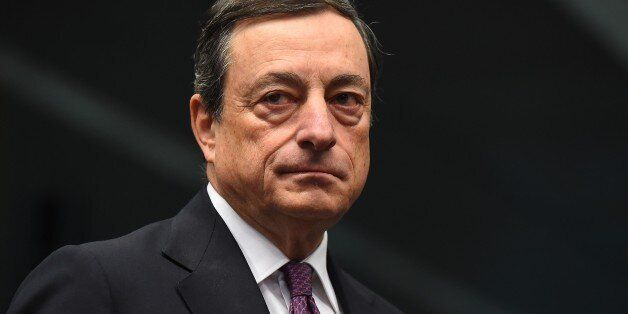 European Central Bank President Mario Draghi attends a Eurogroup meeting at the European Council in Brussels, December 8, 2014. AFP PHOTO/Emmanuel Dunand (Photo credit should read EMMANUEL DUNAND/AFP/Getty Images)
