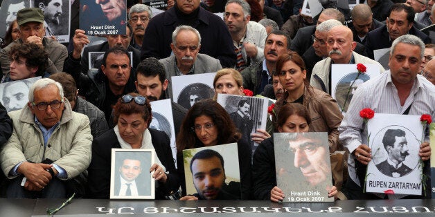 Turkish and Armenian activists gather to protest the killings of Armenians during the last century in Turkey, in Istanbul, Turkey, Thursday, April 24, 2014, a day after Prime Minister Recep Tayyip Erdogan has issued a conciliatory message to Armenians on the eve of the anniversary of the massacre of Armenians almost a century ago, calling the events of World War I