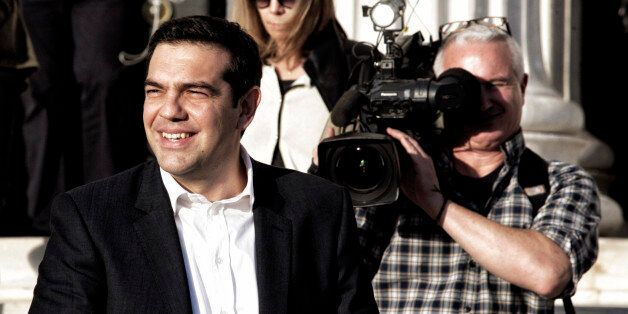 ATHENS, GREECE , JANUARY 23: Opposition leader and head of radical leftist Syriza party Alexis Tsipras leaves news conference in Athens January 23, 2015. Tsipras said on Friday that savings would be safe if his party were to take power in a snap election , which will take place on January 25. (Photo by MIlos Bicanski/Getty Images)