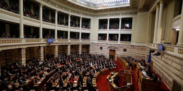 Greek lawmakers attend the third round of voting to elect a new Greek president at the Parliament in Athens on Monday, Dec. 29, 2014, as Greece heads to early general elections after parliament failed to elect a new president in a third and final round of voting. The coalition governmentâs candidate for the post, the 73-year-old former European commissioner Stavros Dimas, garnered 168 votes from parliamentâs 300 seats, short of the 180 votes needed to win. (AP Photo/Thanassis Stavrakis