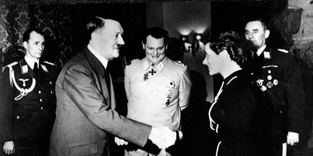 The German Aviatrix and Captain Hanna Reitsch shakes hands with German chancellor Adolf Hitler after being awarded the Iron Cross second class at the Reich Chancellory in Berlin, Germany in April 1941, for her service in the development of airplane armament instruments during World War II. In back, center is Reichsmarshal Hermann Goering. At the extreme right is Lt. Gen. Karl Bodenschatz of the German air ministry. (AP Photo)