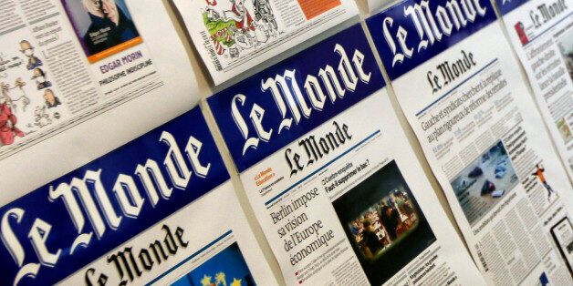 This photo taken Friday, June 25, 2010, shows recent front pages of Le Monde hanging at the newspaper headquarters in Paris. The supervisory board for France's Le Monde is meeting Monday June 28, 2010 to choose a new owner for the iconic but debt-saddled newspaper _ an owner who will take financial control out of the journalists' hands for the first time since 1951. A leading bidder, a group that includes the owner of Spain's El Pais and France's former state telecoms monopoly, said hours before