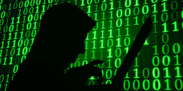 Computer hacker silhouette. Green binary code background