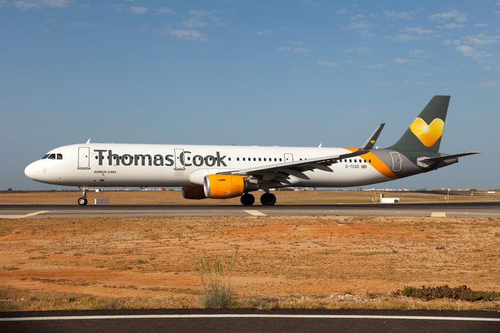 A Thomas Cook Airlines Airbus 321 on the move at Faro airport. 