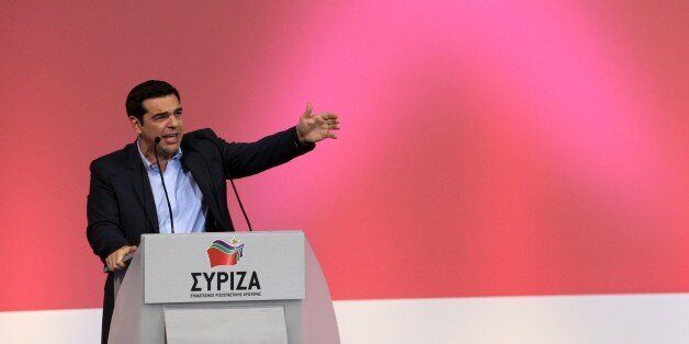 The leader of the Greek Opposition party SYRIZA Alexis Tsipras gestures to supporters during his speech in Thessaloniki on January 20, 2015. Greece votes in snap legislative elections on January 25, 2015 after parliament failed to elect a new president. The economy will be at the heart of the vote. Analysts have warned that a victory in the January 25 election by a leftist party that wants to reverse the anti-austerity policy imposed on Greece in exchange for its international bailout might spar