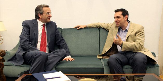 Leader of the New Democracy conservative party Antonis Samaras, left, meets with head of Greece's radical left-wing Syriza party Alexis Tsipras, in the Greek parliament, in Athens, on Monday, June 18, 2012. Samaras, who came first in Sunday's national election, said he will meet with leaders of all parties