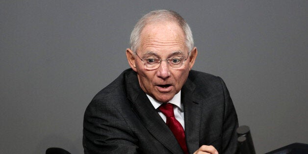 Finance Minister Wolfgang Schaeuble delivers his speech during the final four days debate of a debt free national budget for 2015 at the parliament Bundestag in Berlin, Tuesday, Nov. 25, 2014. (AP Photo/Markus Schreiber)