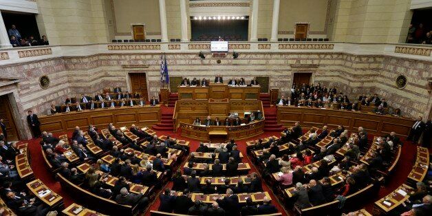 Greek lawmakers attend the third round of voting to elect a new Greek president at the Parliament in Athens on Monday, Dec. 29, 2014, as Greece heads to early general elections after parliament failed to elect a new president in a third and final round of voting. The coalition governmentâs candidate for the post, the 73-year-old former European commissioner Stavros Dimas, garnered 168 votes from parliamentâs 300 seats, short of the 180 votes needed to win. (AP Photo/Thanassis Stavrakis