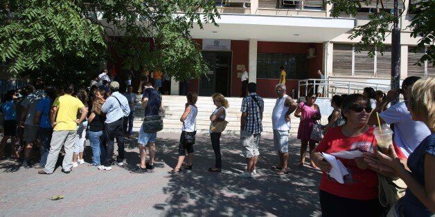 Unemployed Greeks wait in a long line outside an office of Labor Force Employment Organization (OAED) in Athens, Wednesday, Aug. 7, 2013. The country has been surviving on rescue loans from the IMF and other eurozone countries since 2010, when it lost access to long-term debt markets. Austerity measures demanded in return for the 240 billion euro ($319 billion) bailout program have hammered the economy and seen unemployment surge to 27 percent. Greece's annual economic output is around a fifth smaller than when it entered recession in 2008. (AP Photo/Thanassis Stavrakis)