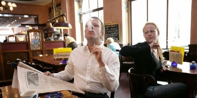 GERMANY - AUGUST 03: Symbolic picture to the topics: passive smoking, smoking, addiction, Our picture shows a smoker smoked a cigarette at a cafe - shirty guests. (Photo by Ulrich Baumgarten via Getty Images)