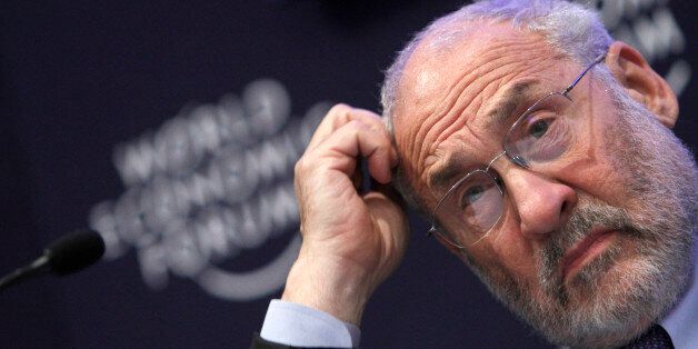 FILE - In this Jan. 26, 2011 file photo, Columbia University professor Joseph Stiglitz scratches his head during a session at the World Economic Forum in Davos, Switzerland. Stiglitz and others worry that too much money flowing to developing economies will form bubbles in stocks and housing prices that could burst. Such money has already inflated worldwide commodity prices to historic levels. (AP Photo/Virginia Mayo, file)