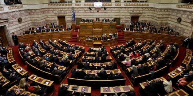 Greek lawmakers attend the third round of voting to elect a new Greek president at the Parliament in...