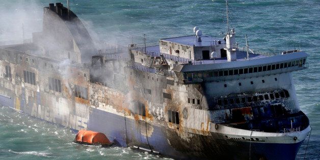 Smoke billows from the Italian-flagged Norman Atlantic ferry that caught fire in the Adriatic Sea, Tuesday, Dec. 30, 2014. A blaze broke out on the car deck of the Norman Atlantic Sunday, Dec. 28, while the ferry was traveling from the Greek port of Patras to Ancona in Italy causing the death of at least 11 people. Italian and Greek helicopter rescue crews evacuated 427 people among passengers and crew members but Italian officials think the death toll could be much higher because of serious discrepancies in the ship's manifest and confusion over how many people were aboard.