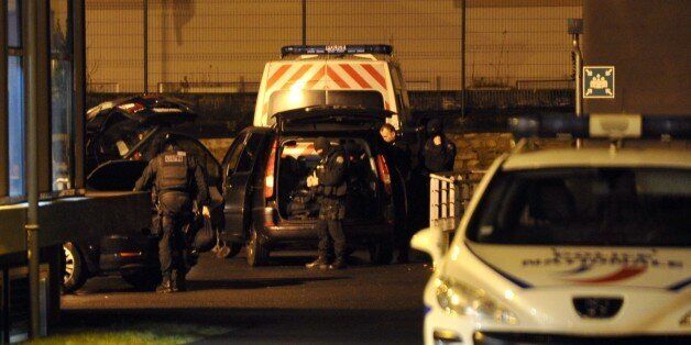 Members of GIPN , the French national police intervention group, arrive at the police station in Charleville Mezieres in northeastern France following a deadly attack in Paris on the offices of satirical weekly Charlie Hebdo, on January 7, 2014. French police mounted a frantic manhunt January 7th for at least two masked men who screamed 'Allahu akbar' as they gunned down 12 people at a satirical weekly, in an attack that prompted vigils across Europe. France's Muslim leadership sharply condemne