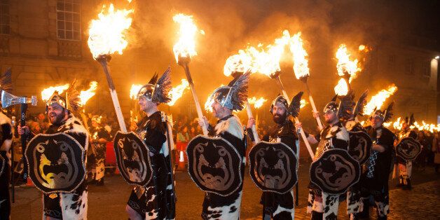 EDINBURGH, UNITED KINGDOM - DECEMBER 30: Men dressed as Vikings take part in the torchlight procession as it makes its way through Edinburgh for the start of the Hogmanay celebrations on December 30, 2014 in Edinburgh, Scotland. (Photo by Roberto Ricciuti/Getty Images)