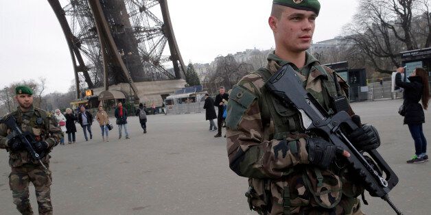 FILE - In this Wednesday Jan. 7, 2015, file photo, French soldiers patrol at the Eiffel Tower after a shooting at a French satirical newspaper in Paris, France. Though it is impossible to gauge in any tangible way the effect the deadly attack on a Paris newspaper will have on recruitment by extremist groups - and there is no evidence so far that it is mobilizing large numbers of would-be jihadis - experts believe the perceived professionalism of the brothers' assault and their subsequent showdow