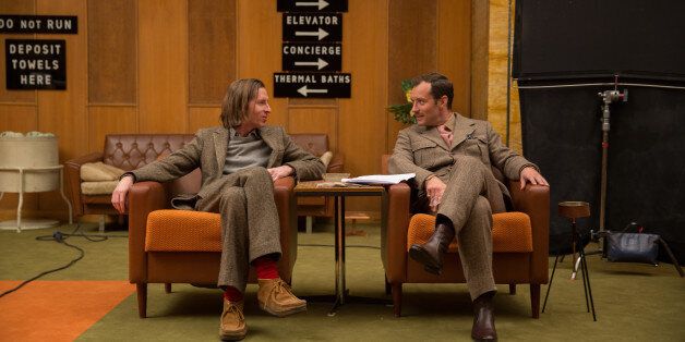 This image released by Fox Searchlight shows director Wes Anderson, left, with Jude Law on the set of