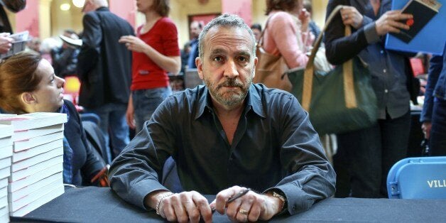 TO GO WITH AFP STORY BY Coralie FEBVREUS writer George Pelecanos attends the 9th edition of the Quais du Polar International Festival in Lyon on April 05, 2014. AFP PHOTO / PHILIPPE MERLE (Photo credit should read PHILIPPE MERLE/AFP/Getty Images)