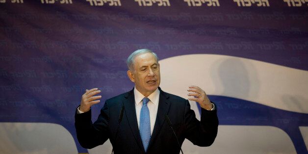 Israel's Prime Minister Benjamin Netanyahu delivers a statment after wining his hard-line Likud party primary in Tel Aviv, Israel, Thursday, Jan. 1, 2015. Israeli Prime Minister Benjamin Netanyahu won the backing of his hard-line Likud party in its primary and will lead it into general elections this March, Israeli media reported Thursday. With about 20 percent of the ballots cast Wednesday counted, Israeli media said Netanyahu had won the support of about 75 percent of electors, giving him an unassailable lead over challenger Danny Danon, a former deputy defense minister. (AP Photo/Ariel Schalit)
