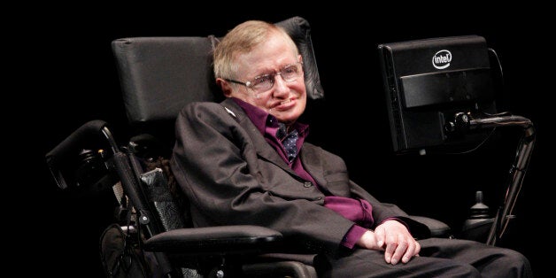 Physicist and best-selling author Stephen Hawking appears, Saturday, June 16, 2012, in Seattle. Hawking was taking part in the Seattle Science Festival Luminaries Series. (AP Photo/Ted S. Warren)