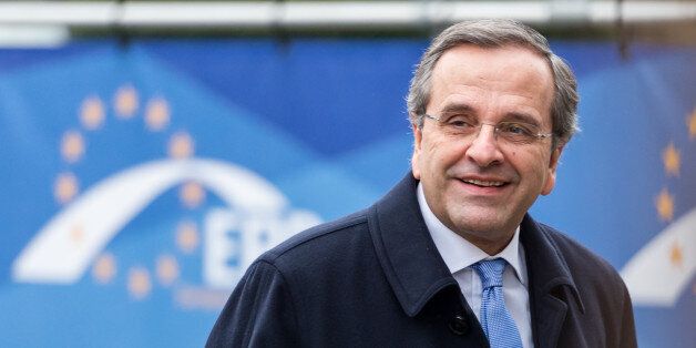 Greece's Prime Minister Antonis Samaras arrives for a meeting of EPP members ahead of an EU summit in Brussels on Thursday, Dec. 18, 2014. European Union leaders meet with the top agenda item an ambitious plan to use EU seed money and loan guarantees to jumpstart investment and revive the EU's growth and job creation rates. (AP Photo/Geert Vanden Wijngaert)