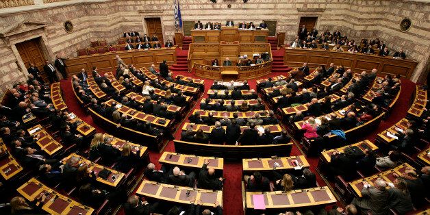 ATHENS, GREECE , DECEMBER 17: Lawmakers preside over the first round of voting to elect a new Greek president at the Parliament on December 17, 2014 in Athens, Greece. Mihaloliakos and Papas The Greek parliament has failed to elect a new president after the first of three rounds of voting. The government's candidate, Stavros Dimas got 160 votes - 40 short of an outright win. If he fails to get elected after the next two rounds there will be a general election. (Photo by Milos Bicanski/Getty Images)
