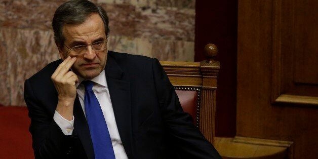 Greece's Prime Minister Antonis Samaras attends the first round of voting to elect a new Greek president at the Parliament in Athens, Wednesday, Dec. 17, 2014. Parliament has failed to elect a new Greek president in the first round of voting, leaving another two tries before the government falls and early elections have to be called. The conservative-led government's candidate, former European Commissioner Stavros Dimas, received 160 votes Wednesday, far short of the 200 needed for an outright win. (AP Photo/Thanassis Stavrakis)