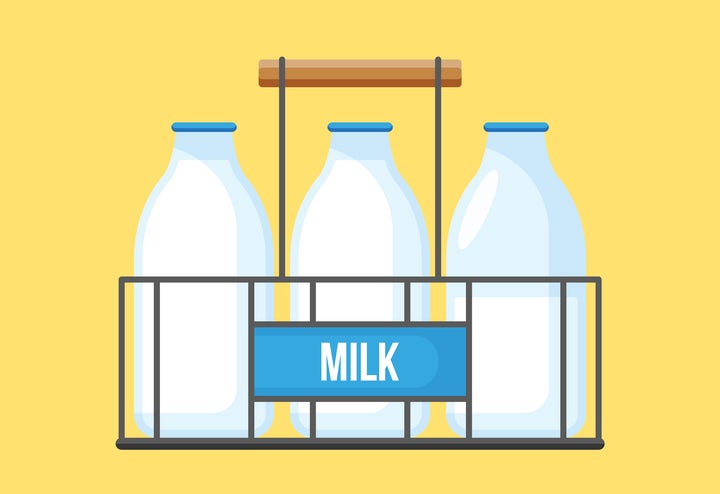 Milk bottles in wire carrier. Retro milk bottles icon for graphic and web design