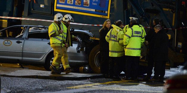 GLASGOW, SCOTLAND - DECEMBER 22: Emergency services attend the scene of the crash in George Square on December 22, 2014 in Glasgow, Scotland. There are reports of a number of fatalities and substantial casualties after a bin lorry appears to have crashed into pedestrians in George Square. (Photo by Mark Runnacles/Getty Images)