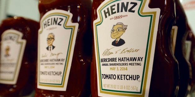 Heinz commemorative Ketchup bottles bear the cartoon likeness of investor Warren Buffett, right, and of his second in command Charlie Munger, left, at a Heinz display in Omaha, Neb., Friday, May 2, 2014, one day before the Berkshire Hathaway annual shareholders meeting which takes place on Saturday. (AP Photo/Nati Harnik)