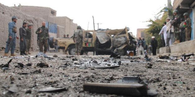 JALALABAD, AFGHANISTAN - DECEMBER 21: Two remote-controlled bombs hit a military vehicle on December 21,2014 in Jalalabad city in the east of Afghanistan, killing one and wounding three others. (Photo by Ziar Khan Yaad/Anadolu Agency/Getty Images)