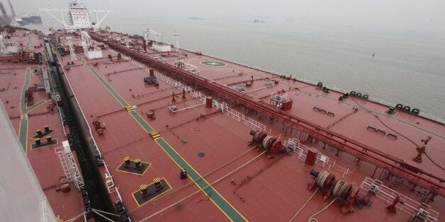 GUANGZHOU, CHINA - NOVEMBER 04: (CHINA OUT) China's largest crude oil tanker 'Kai Gui' with load capacity of 200,000 tons starts its maiden voyage on November 4, 2014 in Guangzhou, Guangdong province of China. China's largest crude oil tanker 'Kai Gui' with total height of over 70 meters is seven times larger than Chinese aircraft carrier 'Liaoning'. (Photo by ChinaFotoPress/ChinaFotoPress via Getty Images)