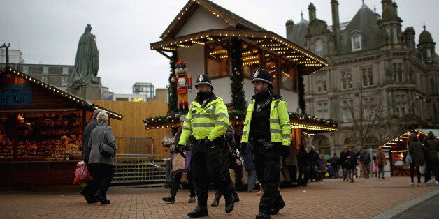 BIRMINGHAM, ENGLAND - DECEMBER 09: Officers from West Midlands police force patrol the streets of Birmingham during a security threat on December 9, 2014 in Birmingham, England. Officers of West Midlands Police continued their patrols as an alleged threat to kidnap and kill an officer was reported anonymously. The overall threat level to police across Britain was raised to substantial in October. (Photo by Christopher Furlong/Getty Images)