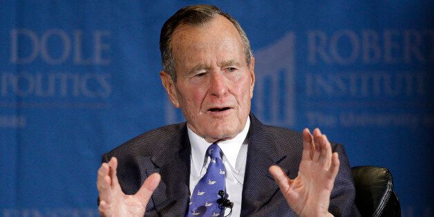 Former President George H.W. Bush answers questions the during an appearance at the University of Kansas sponsored by the Robert J. Dole Institute of Politics Sunday, Nov. 16, 2008 in Lawrence, Kan. (AP Photo/Charlie Riedel)