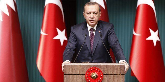 ANKARA, TURKEY - DECEMBER 19: Turkish President Recep Tayyip Erdogan and Emir of Qatar Sheikh Tamim bin Hamad bin Khalifa Al Thani (not seen) hold a press conference during the ceremony of the signature of the political declaration about High-Level Strategic Cooperation Council between Turkey and Qatar during Al Thani's official visit at Presidential Palace in Ankara, Turkey on December 19, 2014. (Photo by Mehmet Ali Ozcan/Anadolu Agency/Getty Images)