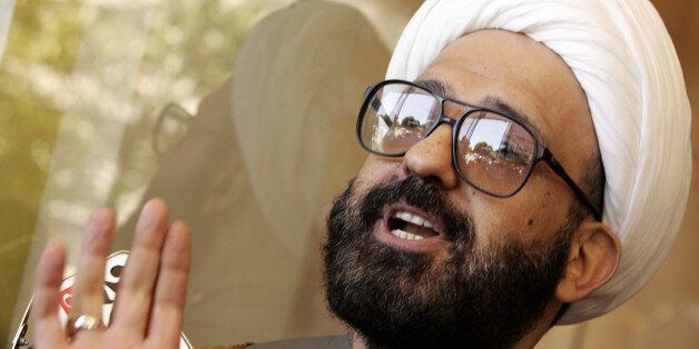 Man Monis, also known as Sheik Haron speaks to the media as he leaves Downing Centre Local Court in Sydney on Tuesday, Nov. 10, 2009.