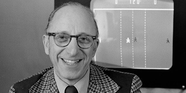 Ralph Baer an engineer for Sanders Associates, Inc., of Nashua, New Hampshire, watches his TV hockey game in this double exposure, February 3, 1977. Baer is responsible for millions of Americans frantically twisting knobs of frustration to move paddles of light in pursuit of targets of futility across their TV screens. (AP Photo)