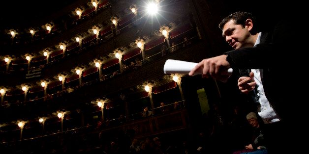 Greek leftwing opposition leader Alexis Tsipras delivers his speech during a meeting with Italian leftwing activists held at the Teatro Valle theater, in Rome, Friday, Feb.7, 2014. (AP Photo/Andrew Medichini)