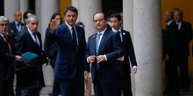 Italian premier Matteo Renzi waves flanked by France's President Francois Hollande, right, as he arrives for a meeting on the sidelines of the ASEM summit of European and Asian leaders in Milan, northern Italy, Friday, Oct. 17, 2014. Russian President Vladimir Putin is looking to get relief from Western economic sanctions imposed since Russia's annexation of the Crimean Peninsula and its support for a pro-Russia insurgency in eastern Ukraine. To that end, he has scheduled a series of meetings on