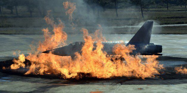 A mock Alphajet is pictured during a fire drill at Cazaux's air base, on January 7, 2014 in Cazaux. AFP PHOTO JEAN PIERRE MULLER. (Photo credit should read JEAN-PIERRE MULLER/AFP/Getty Images)