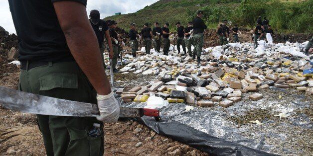 Panama's anti-narcotics personnel burn over 11 tons of cocaine and marijuana in Cerro Patacon, a dump near Panama City, on December 5, 2014. AFP PHOTO / Rodrigo ARANGUA (Photo credit should read RODRIGO ARANGUA/AFP/Getty Images)