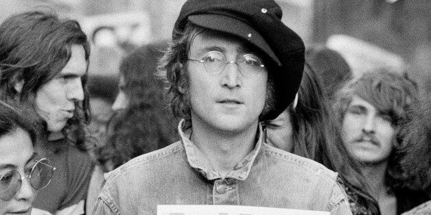 Portrait of British musician John Lennon (1940 - 1980) (center) and his wife, artist and musician Yoko Ono (extreme left) as they attend an unspecified rally in Hyde Park, London, England, 1975. (Photo by Rowland Scherman/Getty Images)