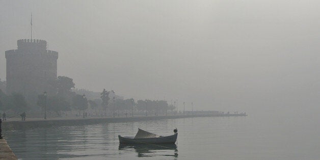 Fog obscures the White Tower, a 16th century monument in the northern Greek port of Thessaloniki, Wednesday, Oct. 30, 2013. Fog is a common occurrence during the year in this northern city, Greece's second largest. (AP Photo/Nikolas Giakoumidis)