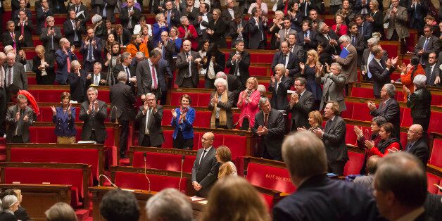Members of French parliament, applaud after the vote for the recognition of the Palestinian State in Paris, Tuesday, Dec. 2, 2014, as opposition members leave the hall in foreground. Franceâs lower house of Parliament has voted to urge the government to recognize a Palestinian state, in the hope that speeds up peace efforts after decades of conflict. Tuesdayâs French vote, approved with 339 votes to 151, is non-binding. (AP Photo/Michel Euler)