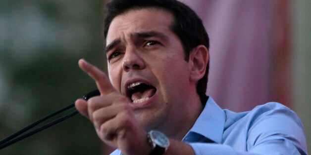 Greece's Left-wing opposition leader Alexis Tsipras addresses his party's supporters during a rally outside Parliament demanding elections, in Athens on Monday June 17, 2013. Exactly one year ago, Greeceâs conservative prime minister won the mandate to form a coalition government with a daunting brief: Restart punishing reforms, keep the debt-stifled country in the eurozone and end months of political chaos. The latter has proved harder, and Antonis Samaras is now making a last-ditch bid to quell a revolt by key allies over his decision to close the countryâs state TV and radio broadcaster, axing nearly 2,700 jobs to meet austerity targets. (AP Photo/Dimitri Messinis)